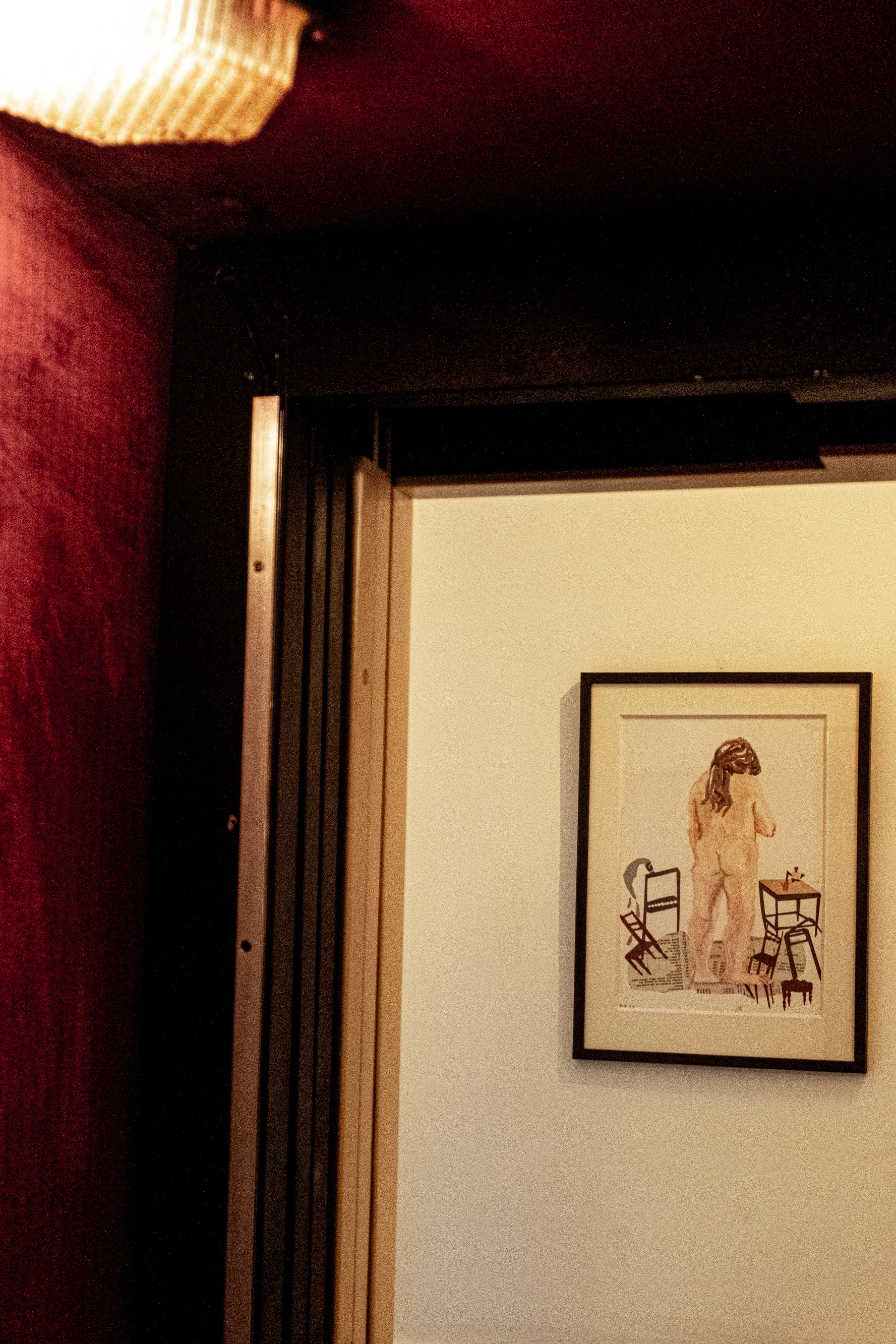 Woman standing from behind with cut out paper chairs